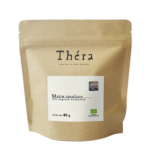Sachet doypack vertical en papier kraft brun recyclable avec une étiquette carrée blanche et un logo "Théra"